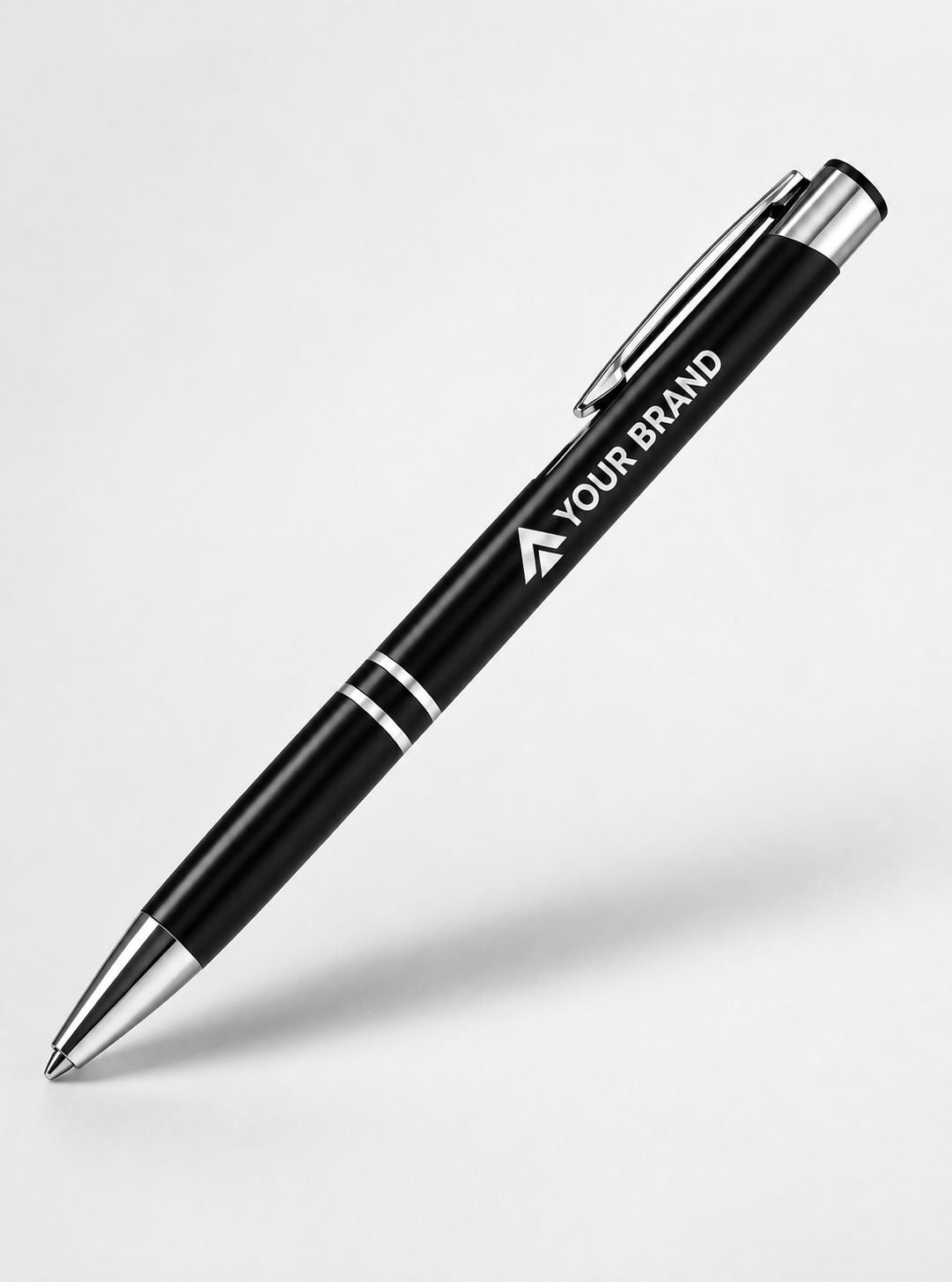A black ballpoint pen with silver accents, featuring the customizable text 'YOUR BRAND' printed on the barrel, shown on a light gray background.