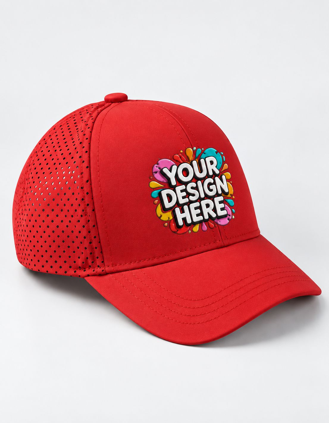 A red sports cap with a perforated mesh back and a colorful custom graphic on the front that reads 'YOUR DESIGN HERE'.
