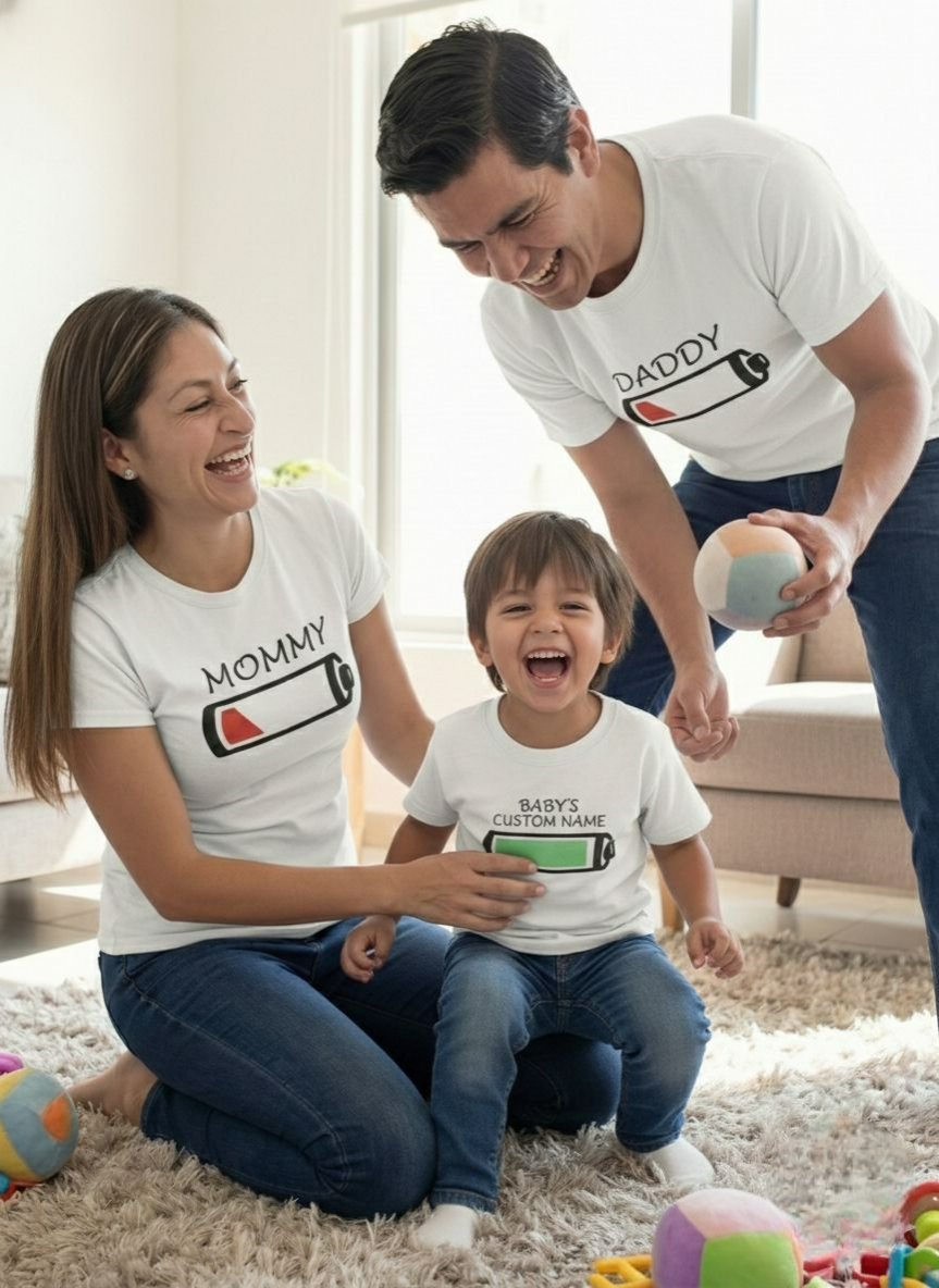 Family of three wearing matching 'Battery' Tshirts