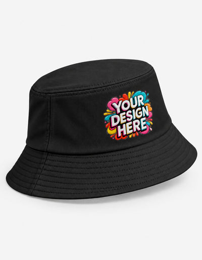 A black bucket hat with a colorful 'YOUR DESIGN HERE' graphic printed on the front, displayed on a clean white background.