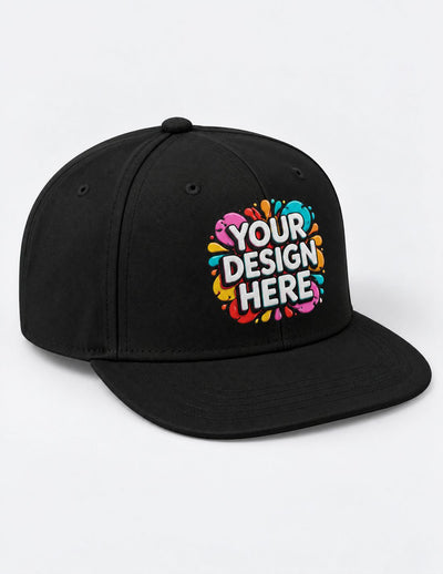 A black flat-brim snapback cap with a colorful graphic on the front that reads 'YOUR DESIGN HERE' in white text over a multicolor paint-splatter style design, shown on a plain light background.