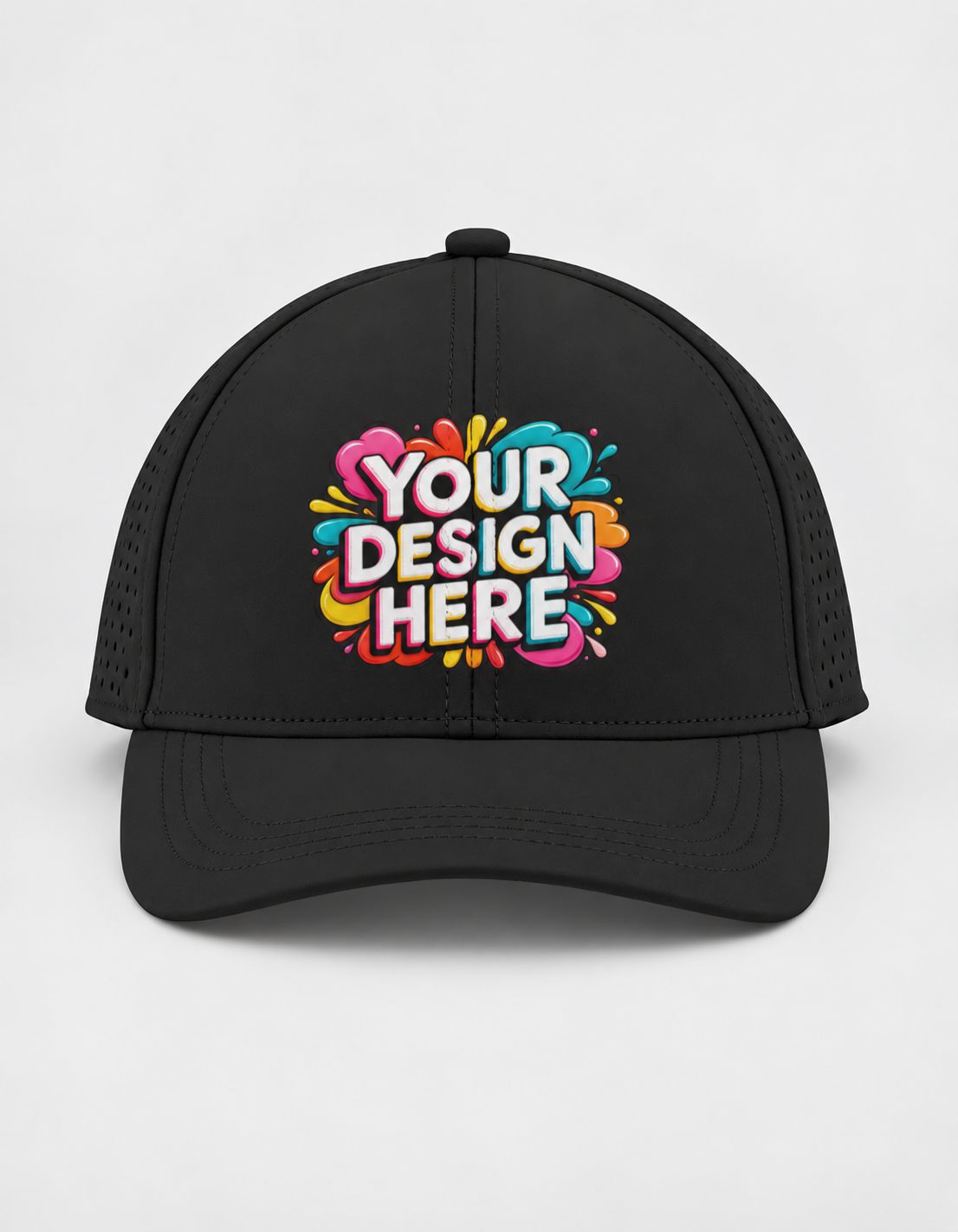 A black sports cap with a colorful 'YOUR DESIGN HERE' mockup graphic on the front, set against a plain light gray background.