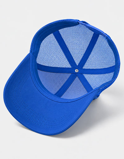 A bright blue trucker-style baseball cap with a solid blue curved brim and blue mesh back panels, shown from an angled top-down perspective on a light gray background.