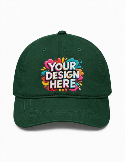 A dark green baseball cap with a colorful 'YOUR DESIGN HERE' mockup graphic on the front, set against a plain white background.