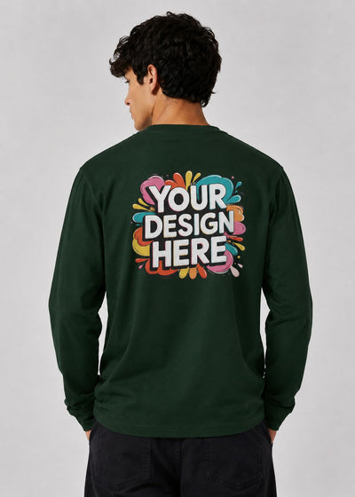 A man viewed from the back wearing a dark green long-sleeve t-shirt with a colorful 'YOUR DESIGN HERE' mockup graphic printed on the back, set against a plain light gray background.