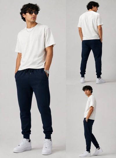 A model shown in three views wearing a white crew-neck t-shirt, navy blue jogger sweatpants, and white sneakers against a light gray studio background.