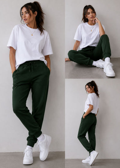 A three-panel lifestyle photo of a woman wearing dark forest green drawstring sweatpants and a white t-shirt with white sneakers, posed against a neutral light gray wall.