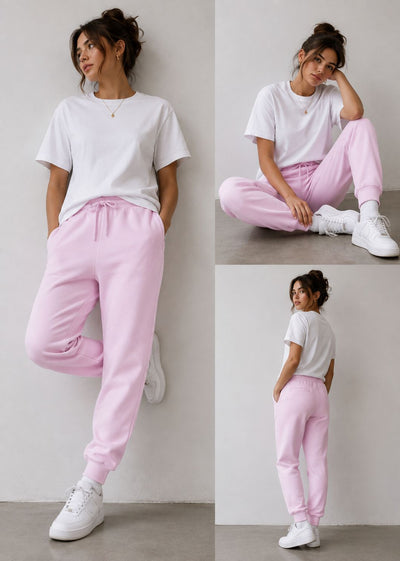 A woman modeling a casual outfit in three poses against a light gray wall. She wears a white short-sleeve crewneck T-shirt and light pink jogger sweatpants with white sneakers.