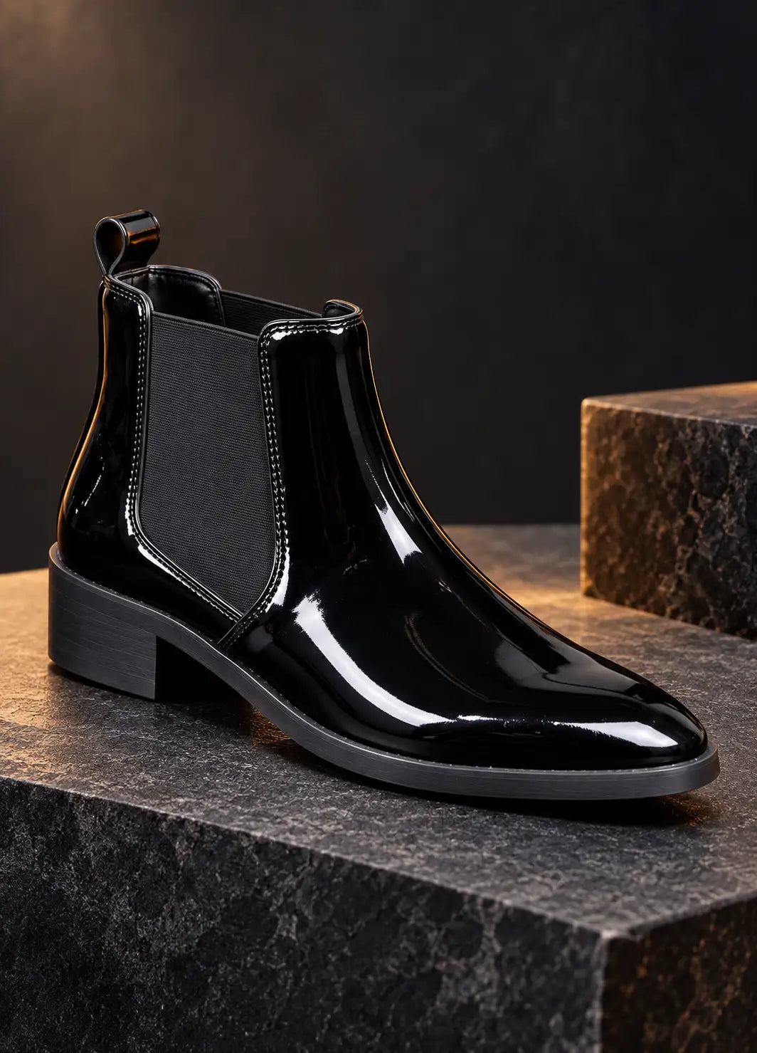 Single black patent Chelsea boot with elastic side panel and pull tab