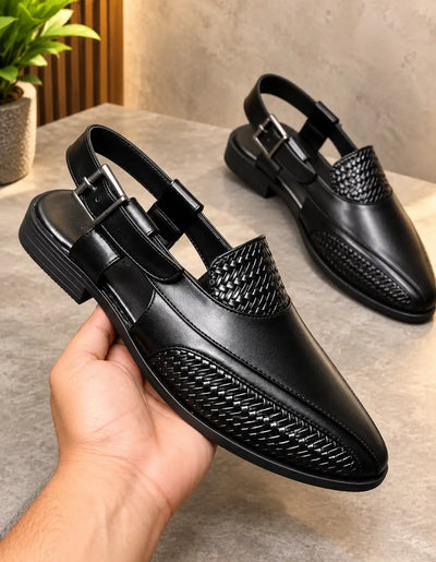 Black men's Peshawari sandal with woven panels, open heel, and adjustable buckle strap