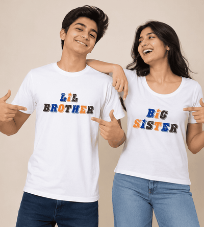 A man and a woman posing together in matching white graphic t-shirts. The man's shirt says 'LIL BROTHER' and the woman's shirt says 'BIG SISTER' in a colorful, textured font.