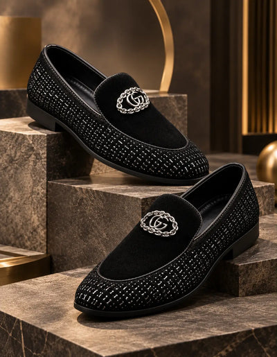 Pair of black partywear loafers with embellished uppers and chain emblems