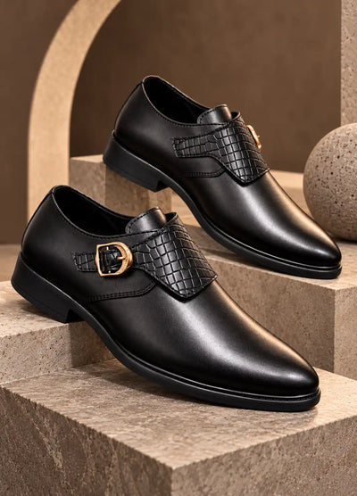 Pair of black faux leather monk strap shoes with woven panels and gold-tone buckles