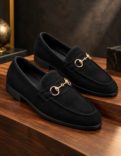 Pair of black suede-look moccasins with gold-tone horsebit hardware