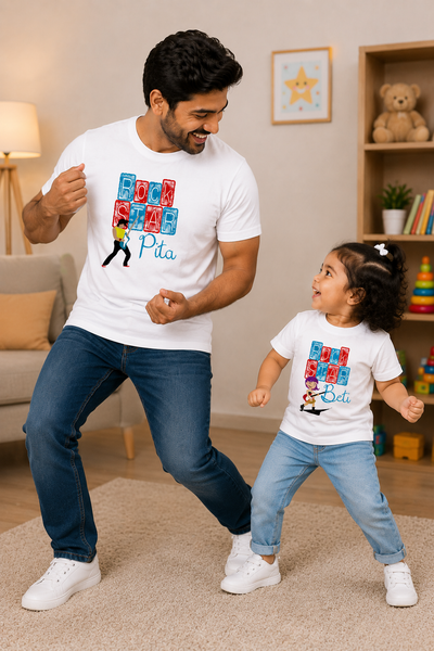 Man and child dancing together in a living room with matching t-shirts.