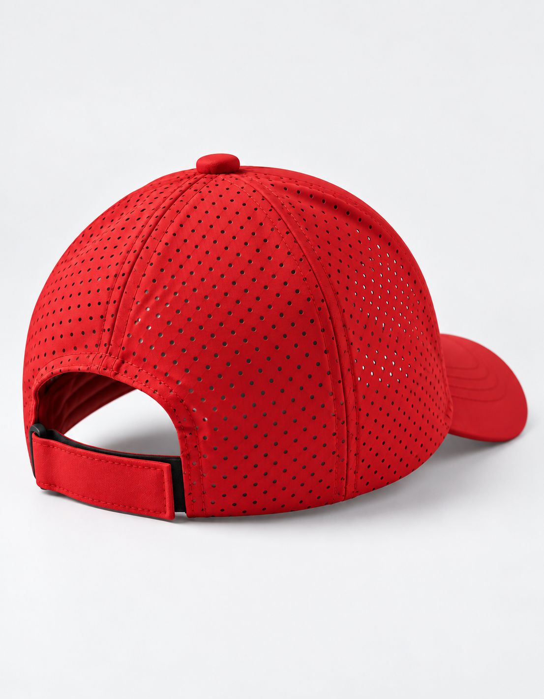 Red perforated sports cap shown from a rear three-quarter angle on a clean white background.