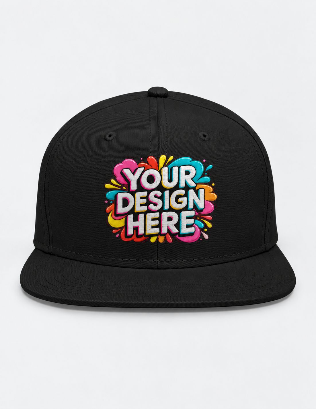 A black flat-brim snapback cap with a colorful 'YOUR DESIGN HERE' mockup graphic on the front, set against a plain light gray background.